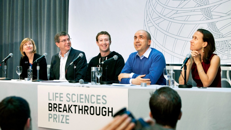 Susan Desmond-Hellmann, Arthur Levinson, Mark Zuckerberg, Yuri Milner, Anne Wojcicki sit as a panel during a press conference