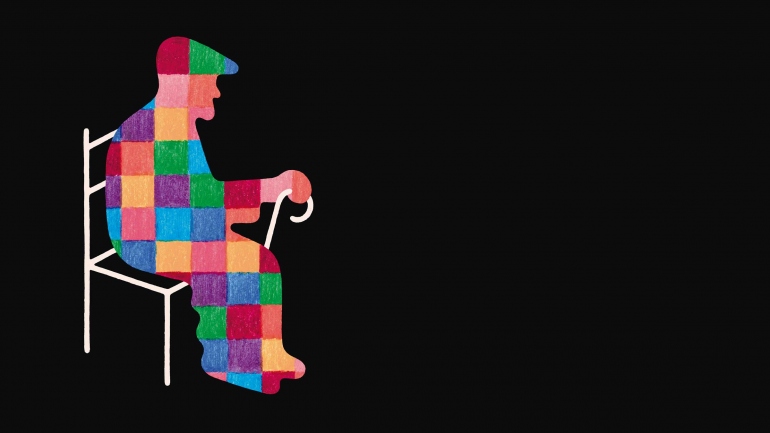 An old man made up of a patchwork of colors sits on a chair