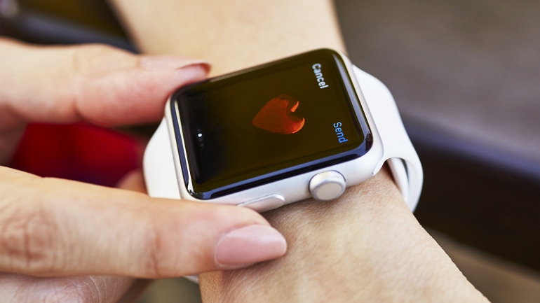 an Apple Watch with a heart on its screen