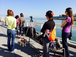 Team members set up near AT&T Park to film the opening portion of their video.