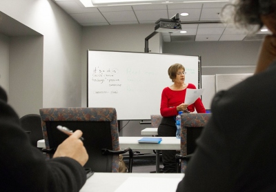 JVS instructor Linda Bryan leads a grammar exercise for EXCEL interns.