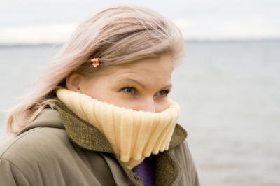 woman shivering in cold weather