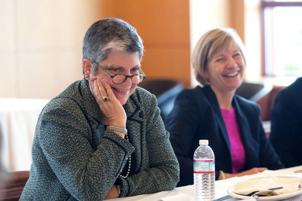 UC President Janet Napolitano and UCSF Chancellor Susan  Desmond-Hellmann laugh at a joke during a lunchtime  discussion with students.