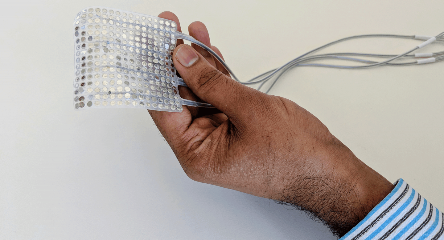 Hand holding an electronic array. 