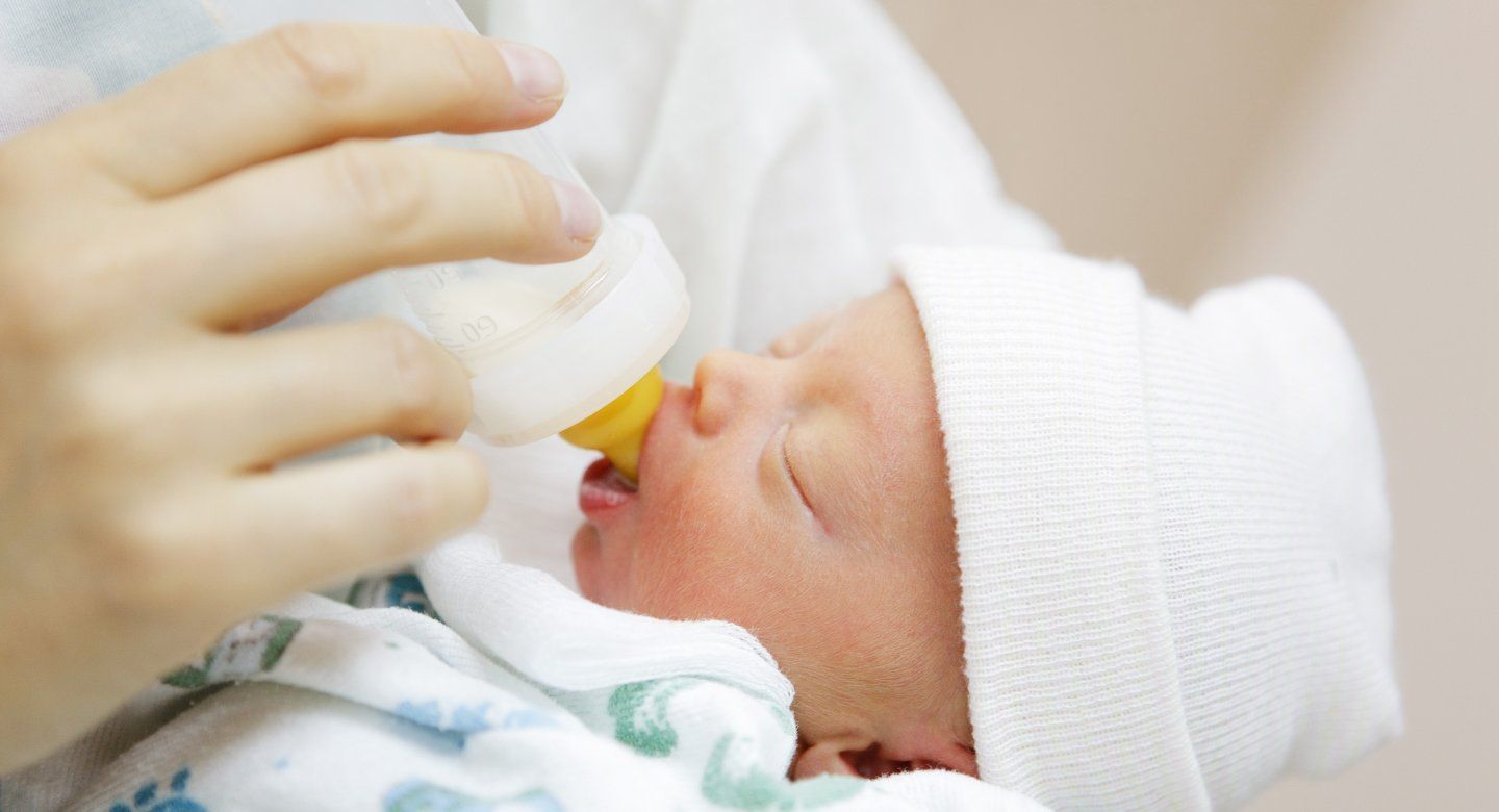 bottle-feeding a newborn