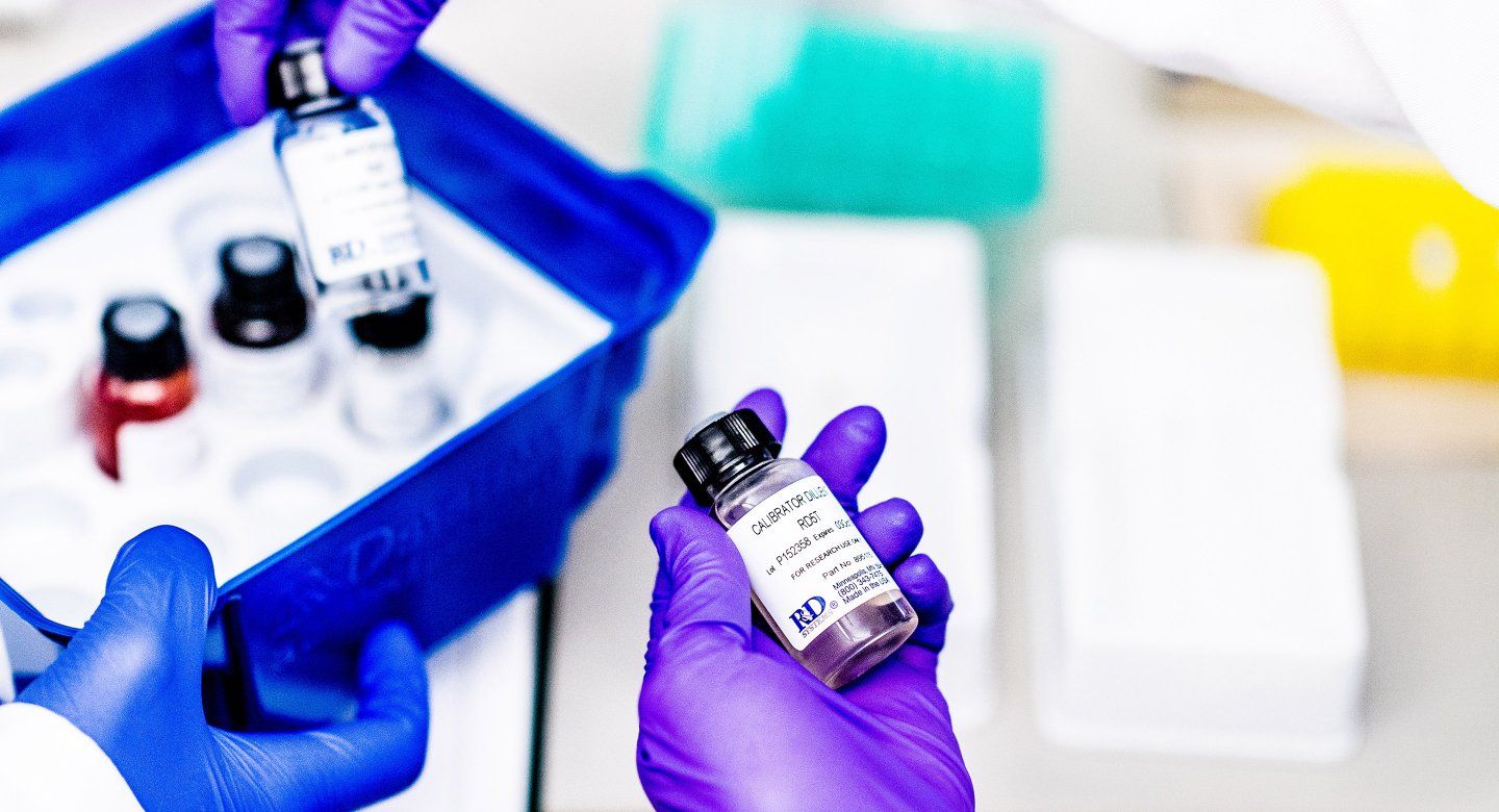 hands hold medicine in lab of Michael Matthay