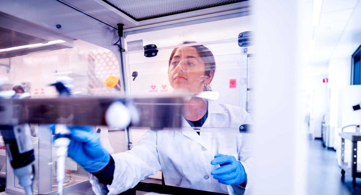 A lab worker prepares samples in a lab.