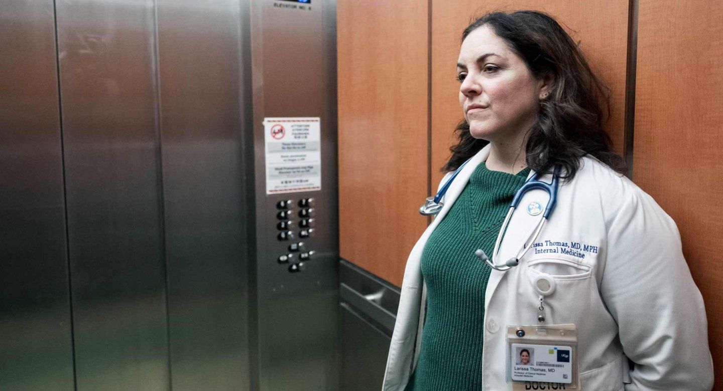 Larissa Thomas, a medical doctor, rides an elevator at Zuckerberg San Francisco General Hospital.