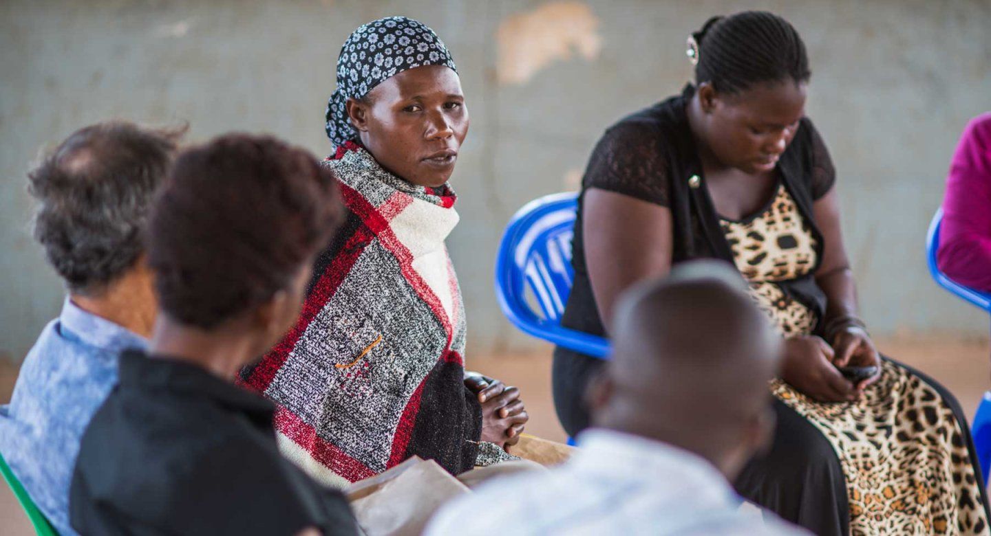 A group of women at a district hospital in Uganda discuss HIV care.