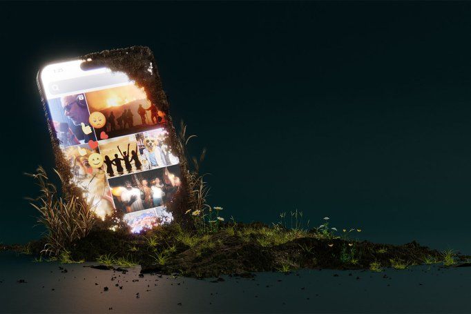 A large smartphone, partially buried in soil, is set against a dark background, with a brightly lit screen showing multiple images: people celebrating and dancing, dog memes and photos, a wildfire, and a podcaster, along with thumbs-up, heart, smiley face, and angry face emojis.