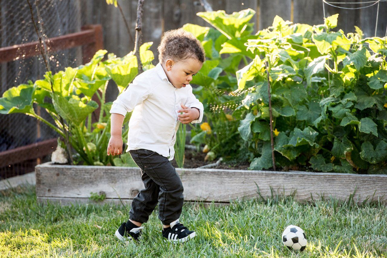 kid kicks a soccer ball