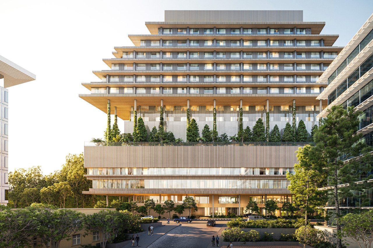 The terraced hospital has a floor in the middle with trees and balcony views