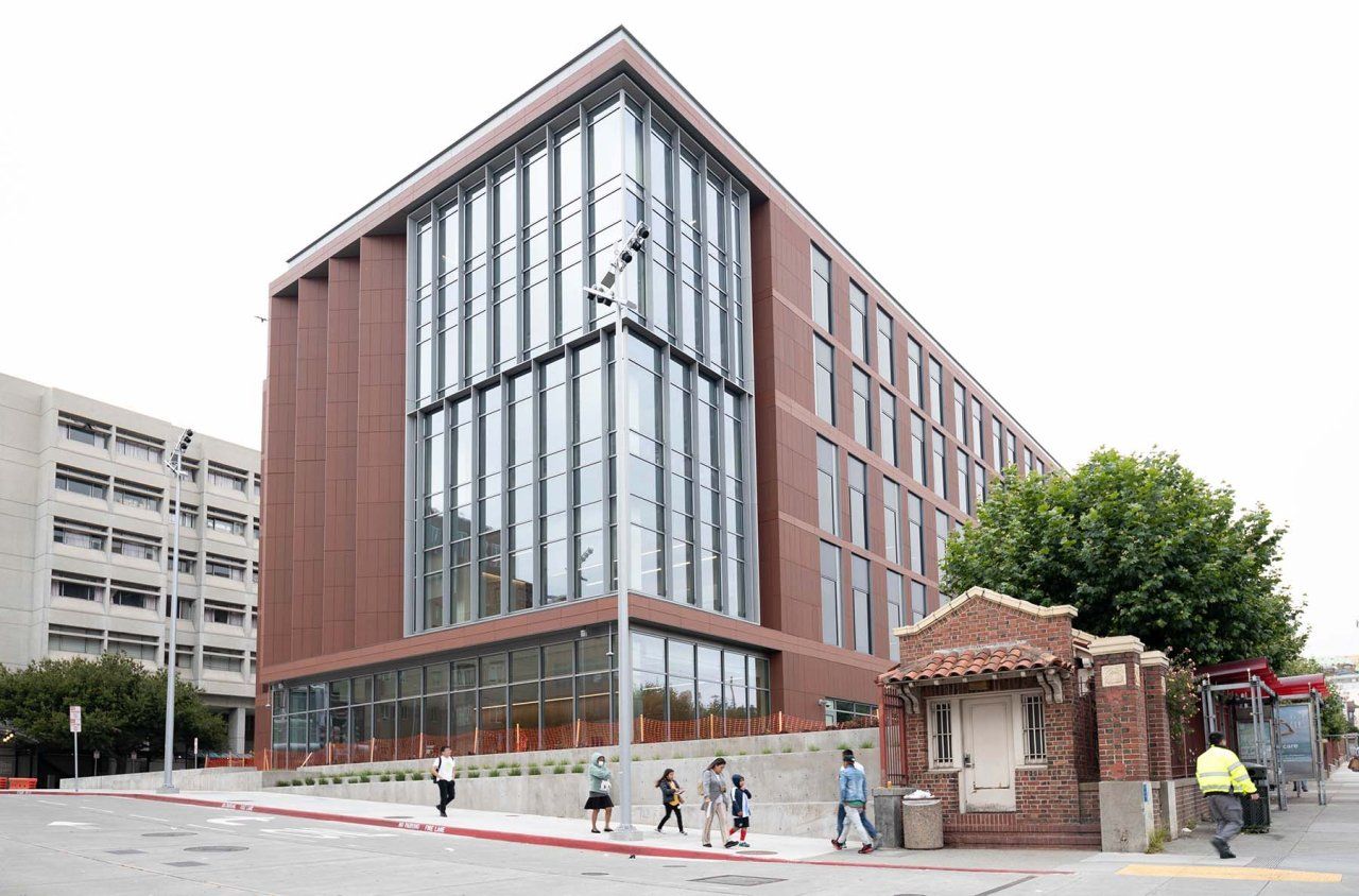 Pedestrians walk past the new Pride Hall building at ZSFG