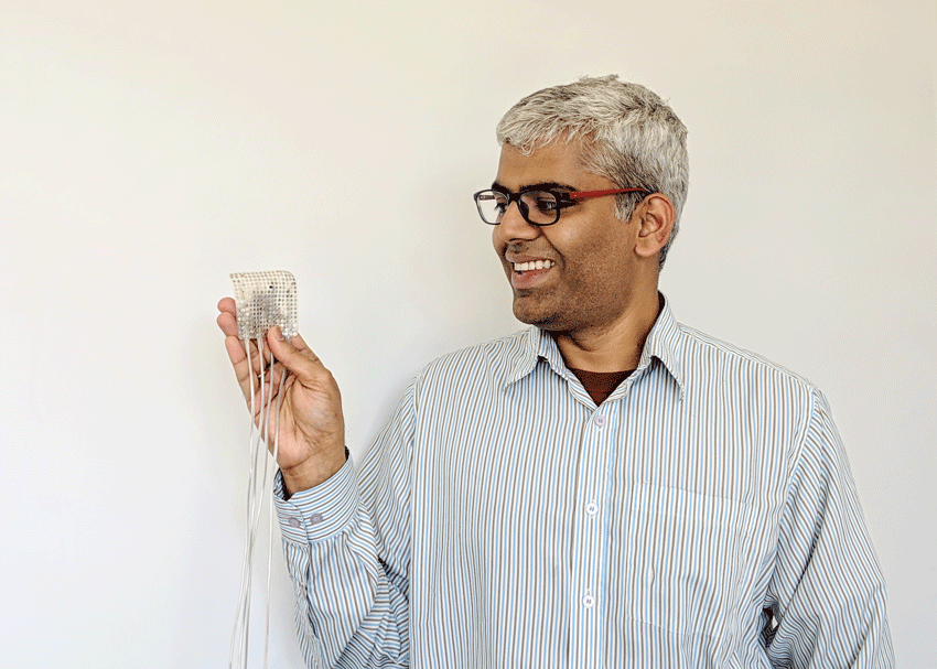 Gopala Anumanchipalli holding electrode. 