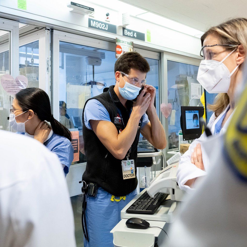 Medical workers pack into a crowded PACU