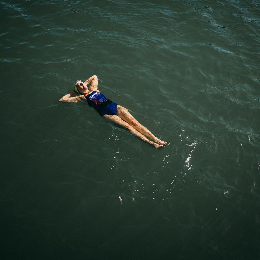 Angie Jacobson floats on her back in the bay