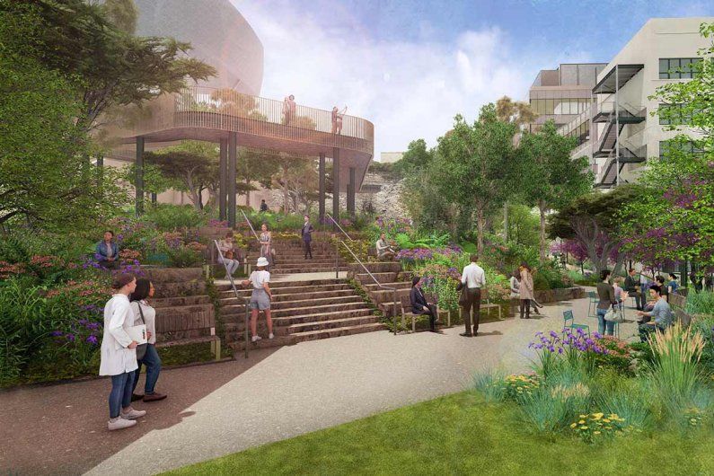 A rendering showing people walking through a park between new buildings.