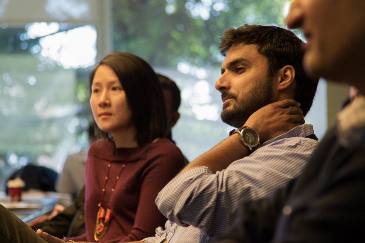 student listens to speakers