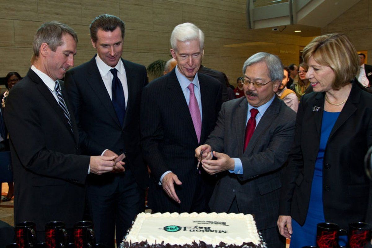 Government Official cutting a cake