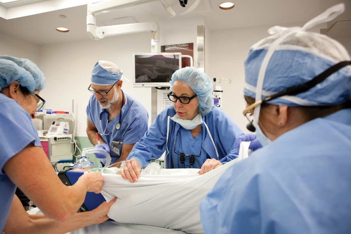 Medical staff assisting a patient in emergency room 