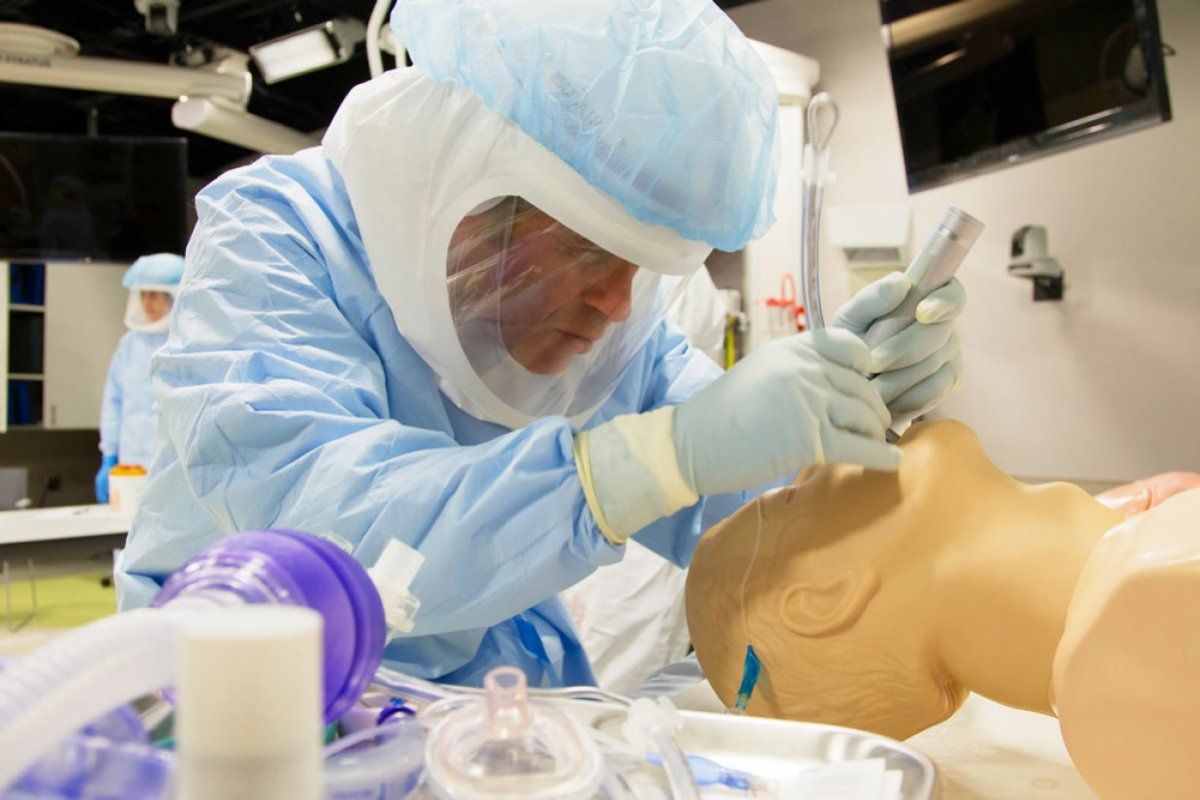 Doctor working on medical doll