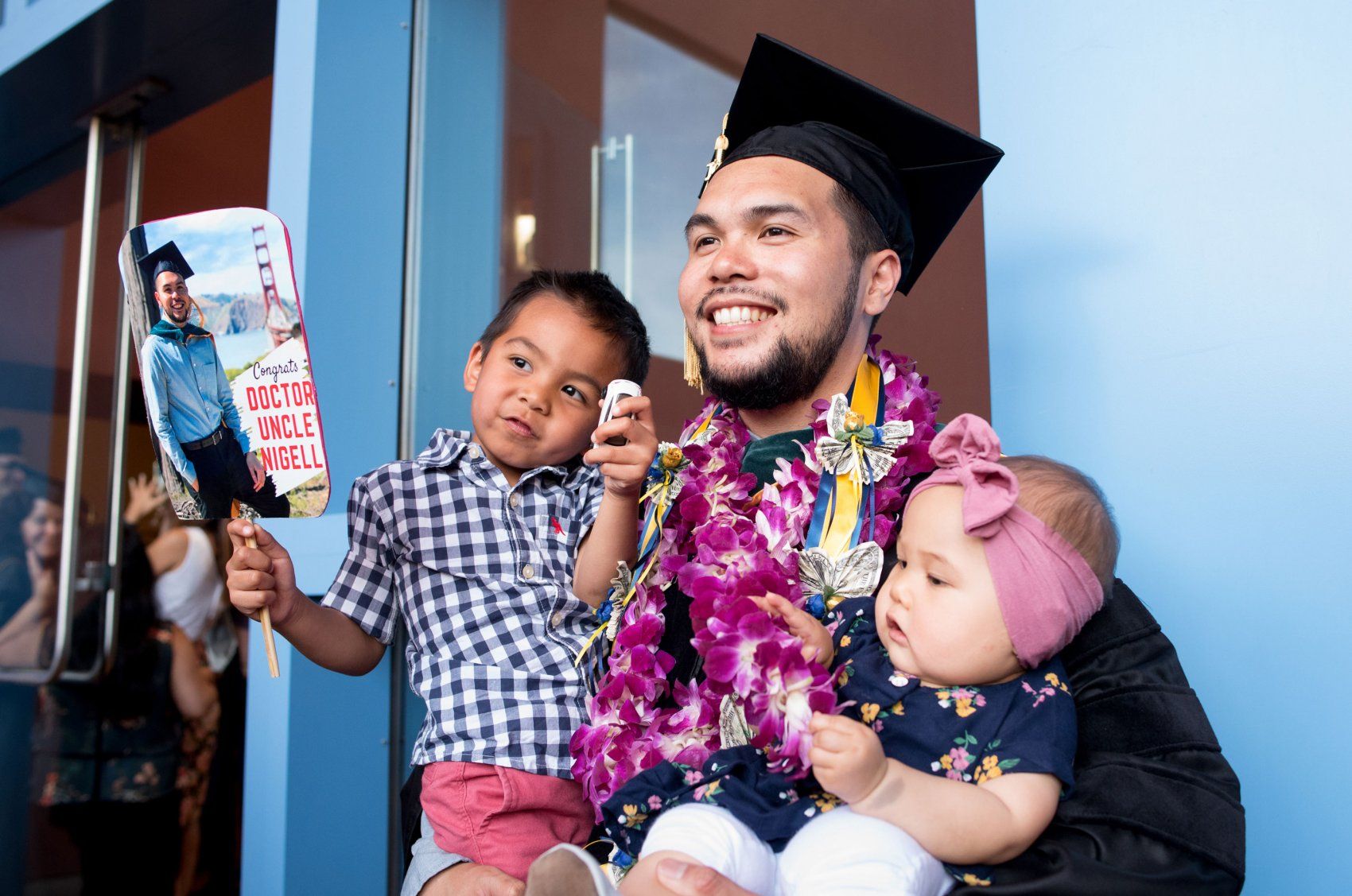 Graduating student with young niece and nephew