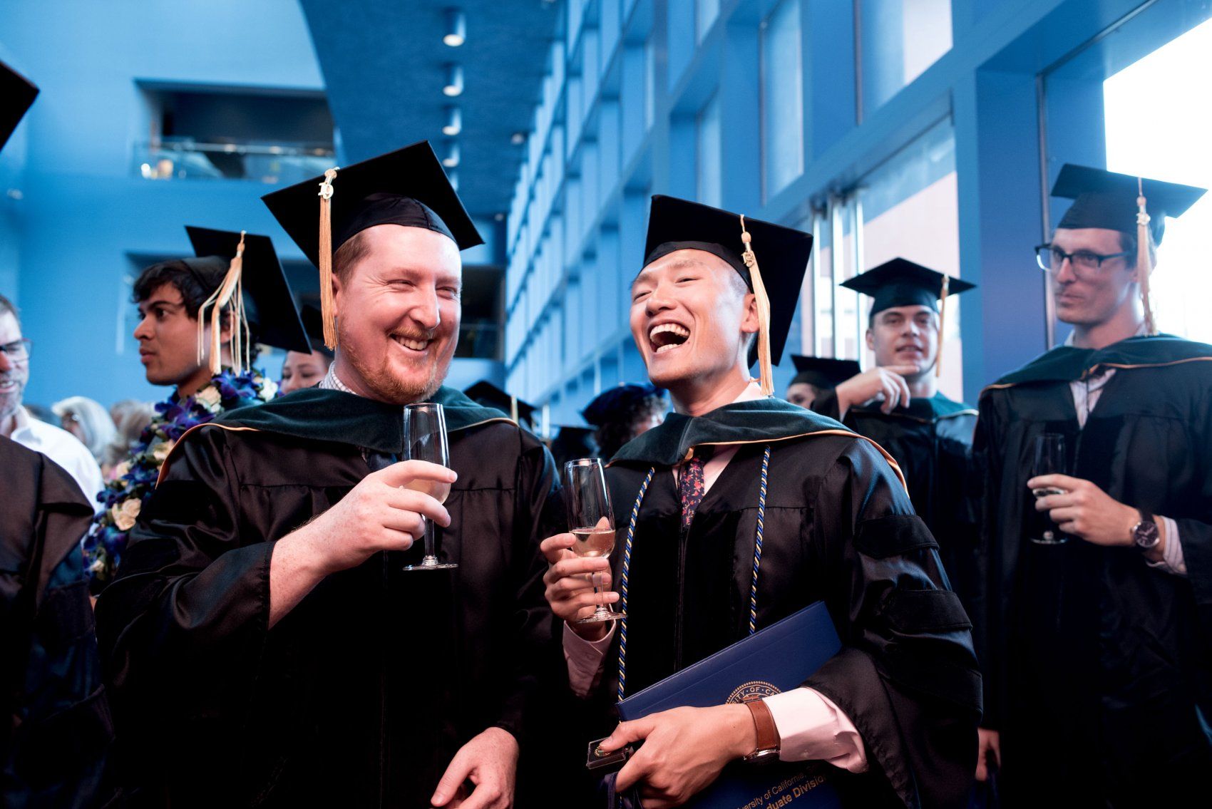 Graduating students celebrate with champagne