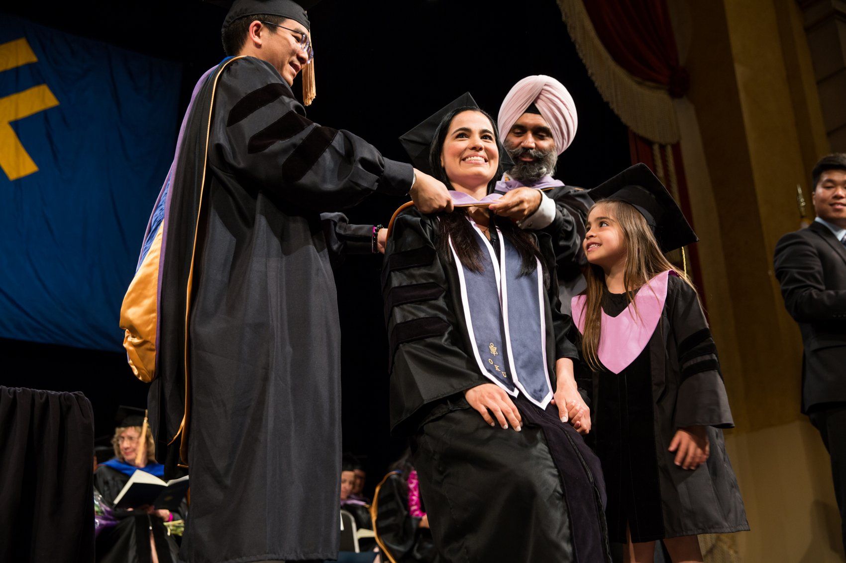 Londono receives hood as daughter watches