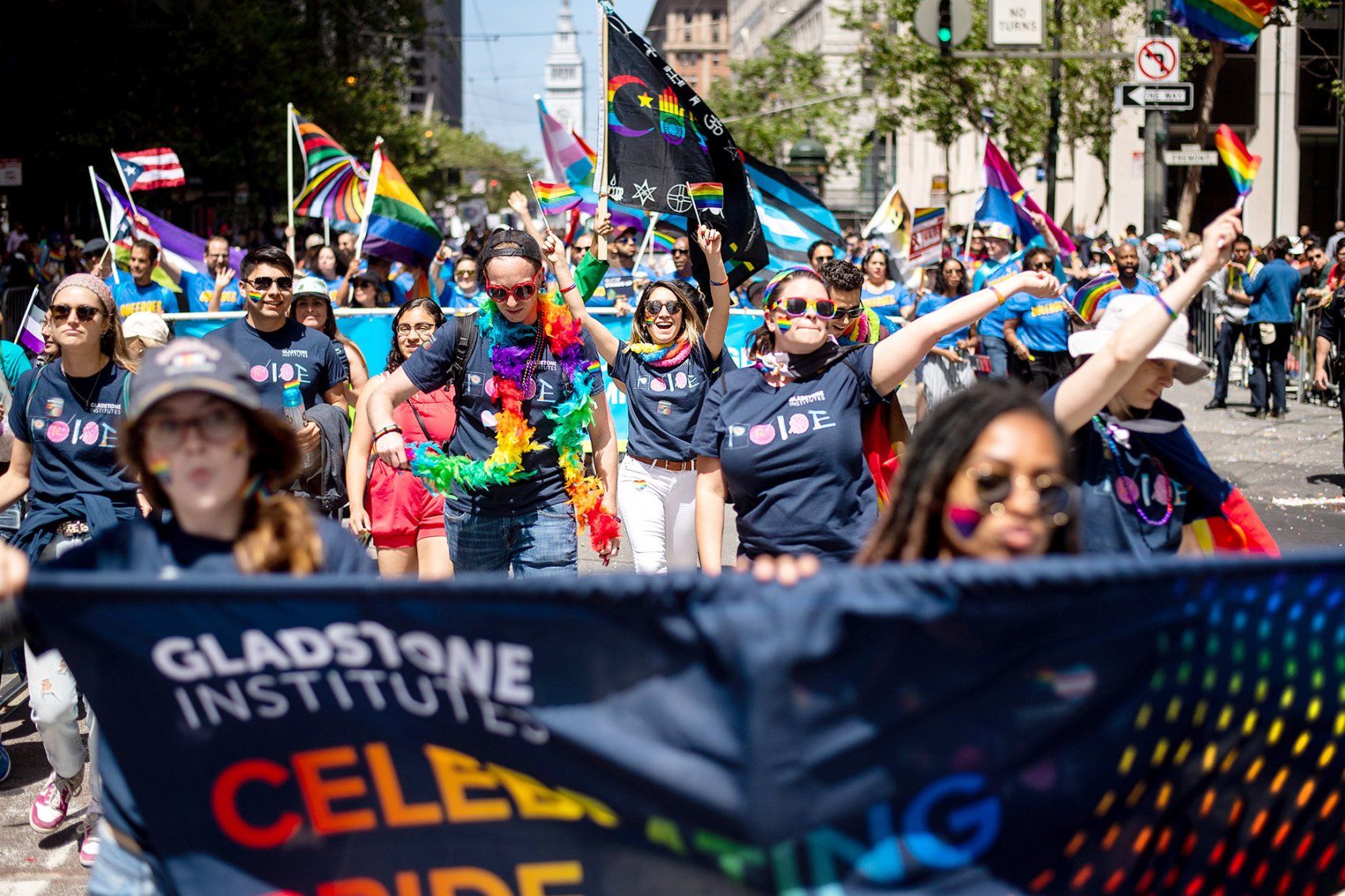 group of marchers walk down Market Street