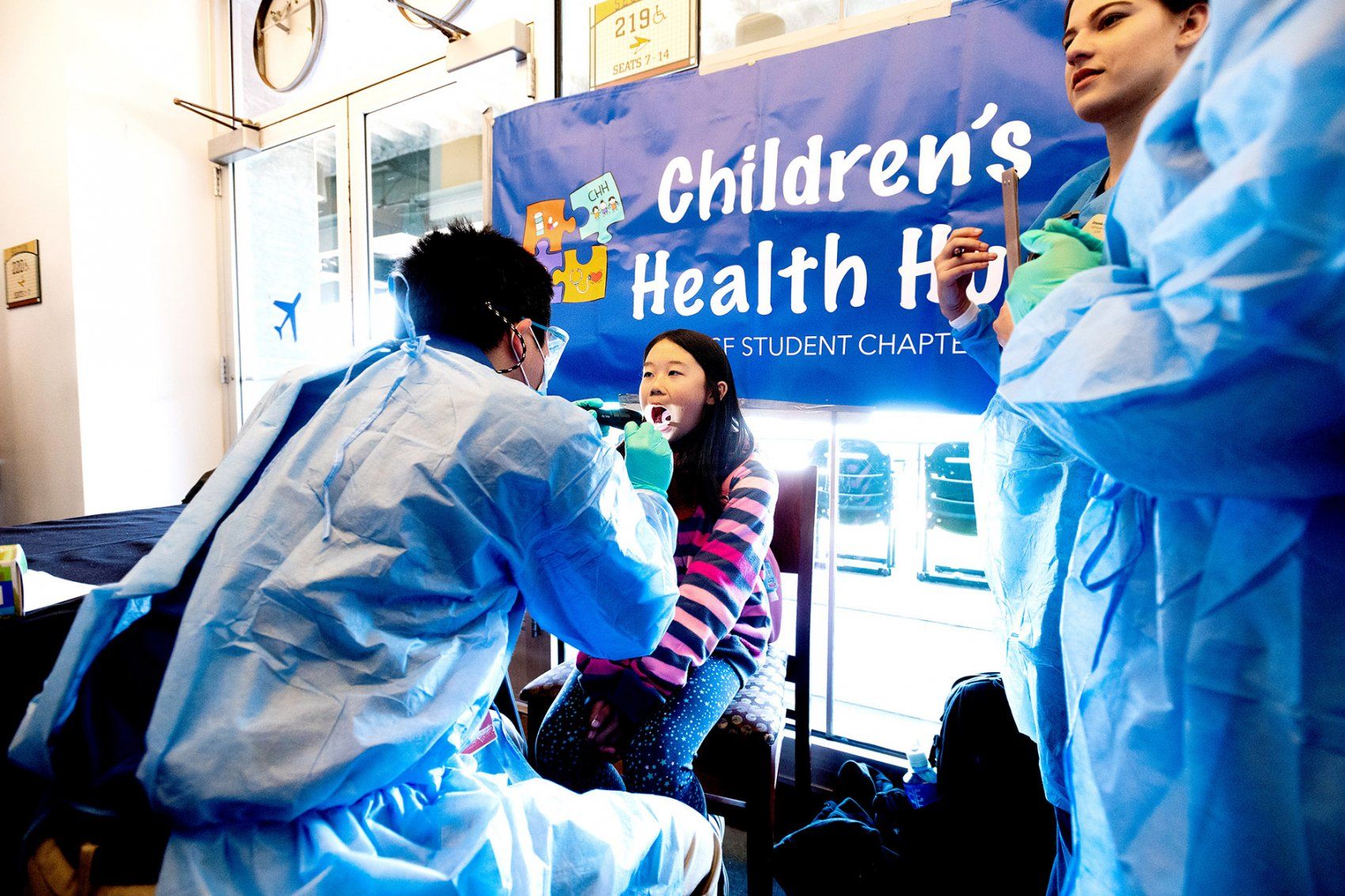 a girl gets a dental exam