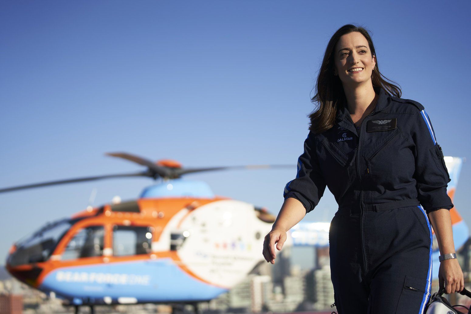 Flight nurse in front of hospital helicopter