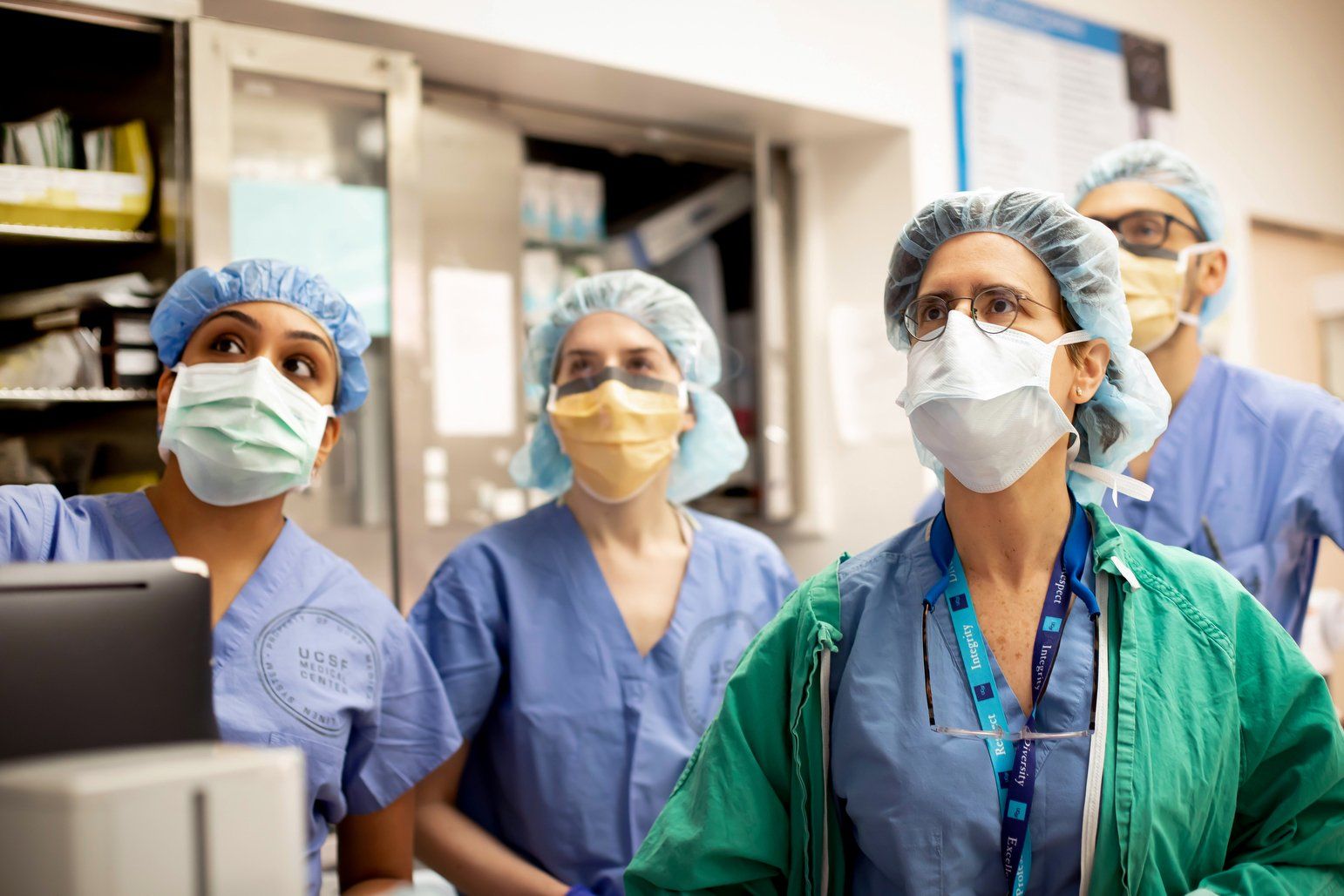 Surgeon and medical students in surgical scrubs