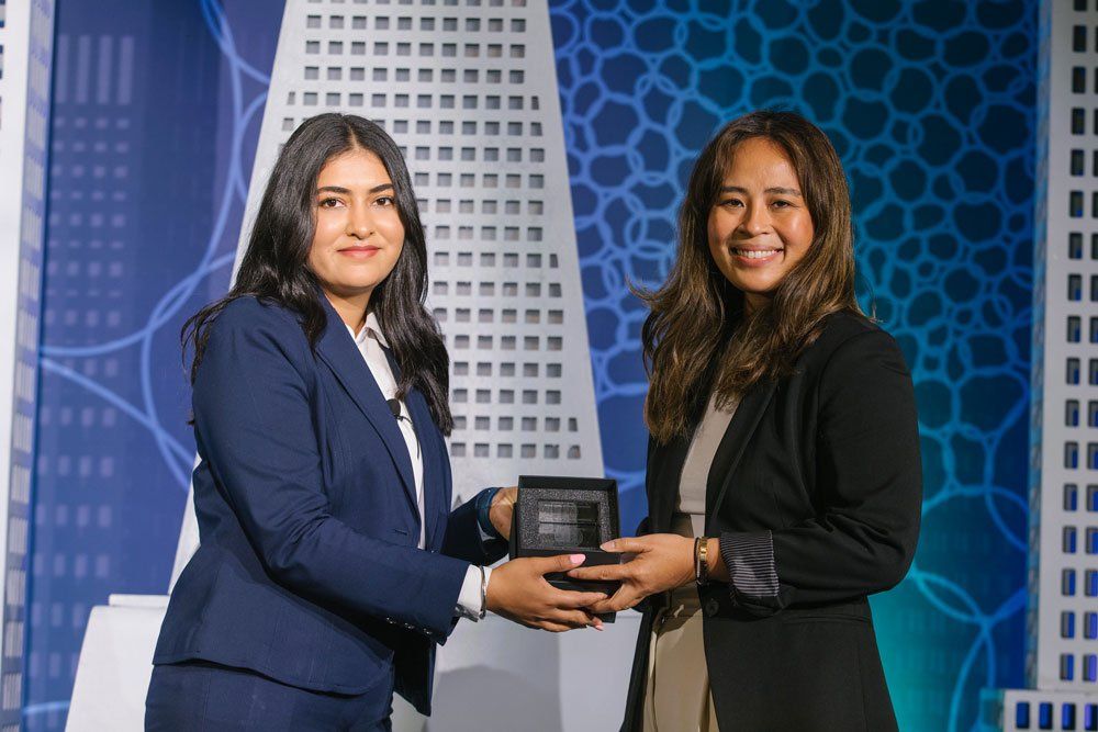Marielle Reataza (right) receives the Alumni Early Career Award