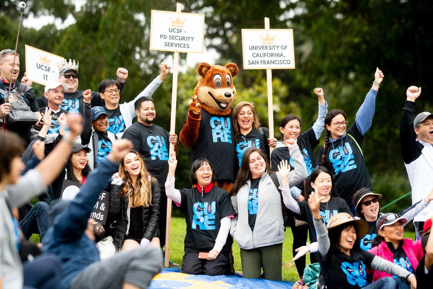 Large group of UCSF employees wearing matching tshirts at the AIDS Walk parade