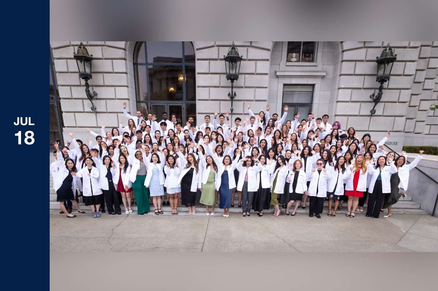 July 18 - Entire class in white coats outside theater posing.
