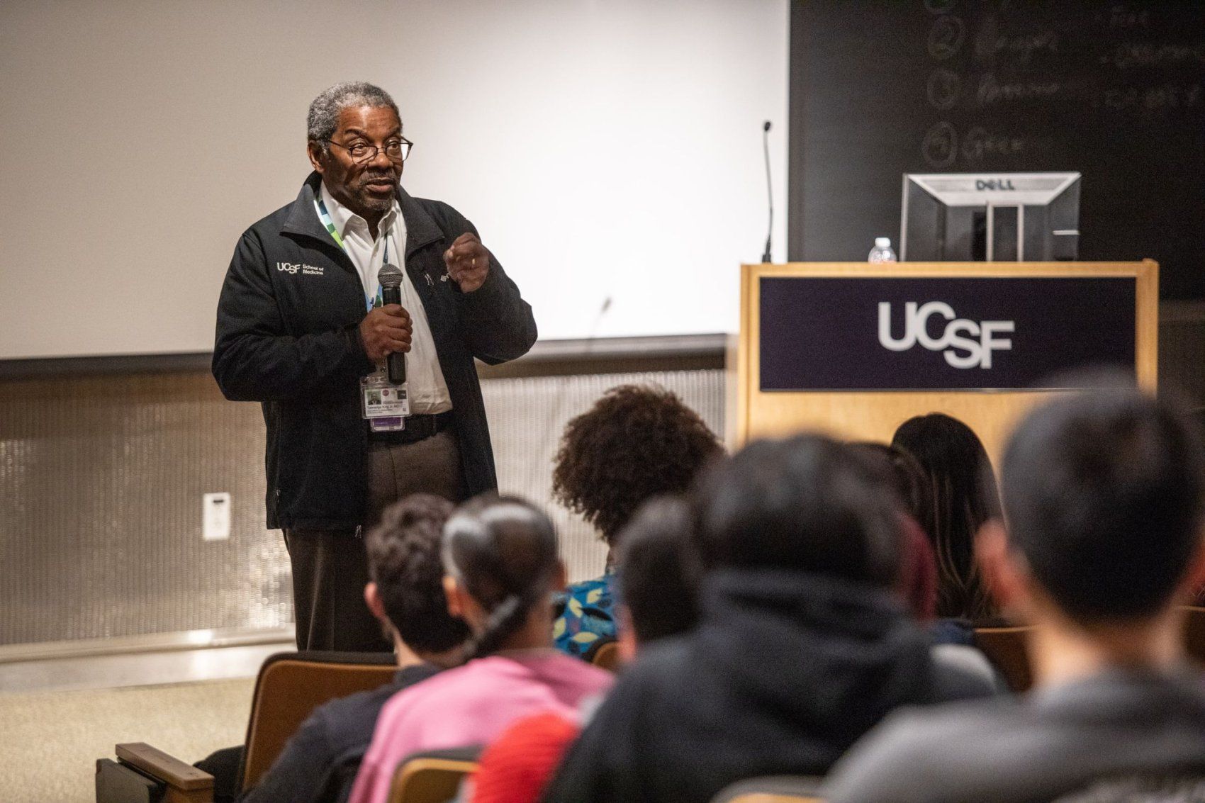 Dr. Talmadge King Jr. speaking at a podium.