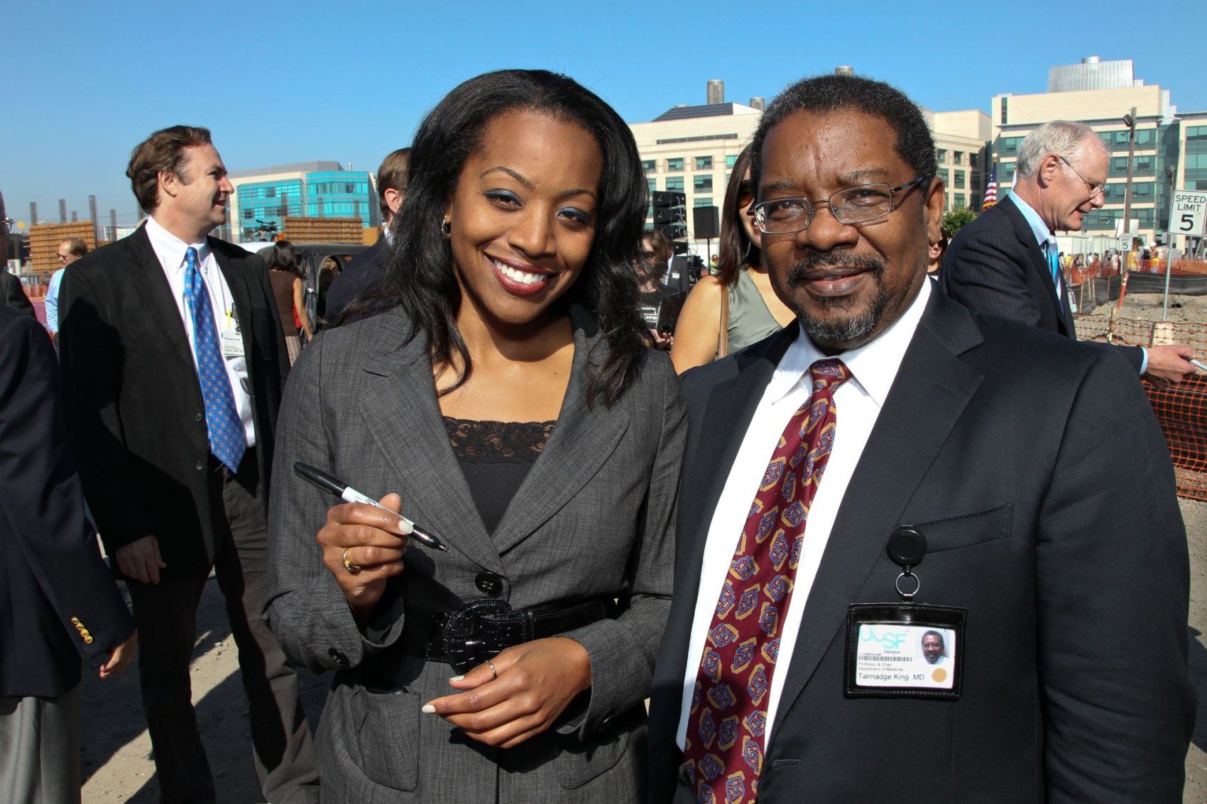 Dr. Talmadge King Jr. posing with woman at event.