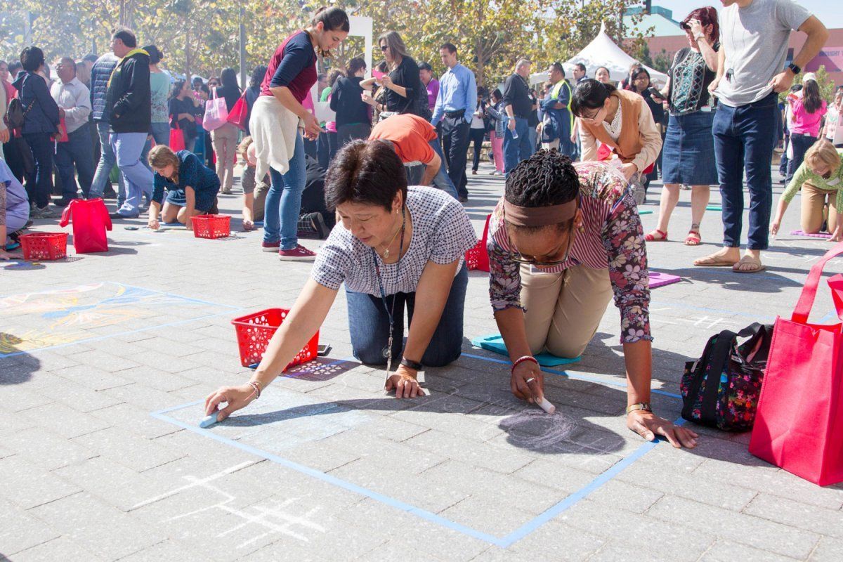 Bonz Otzuki and Michele Davis of UCSF Community and Government Relations participate in the chalk art contest