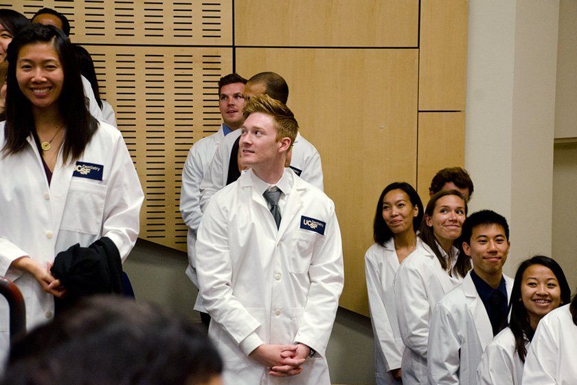 students standing at the white coat ceremony