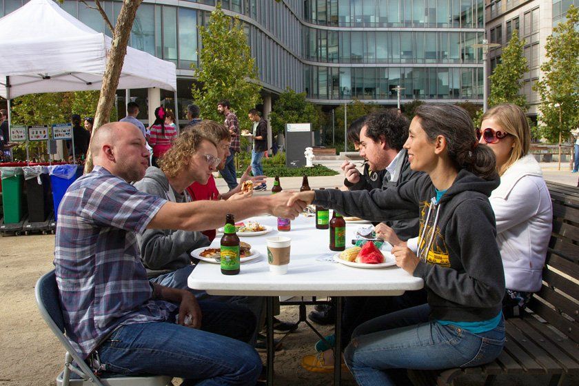 Sam Myers, front left, and Maxine Zylberberg, front right, introduce themselves at the Graduate Division Celebration Barbeque