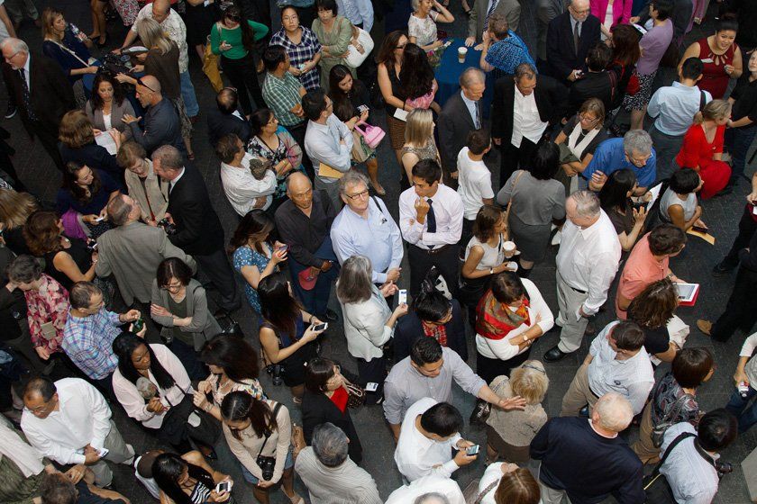 School of Medicine faculty, students and families socialize before the White Coat ceremony