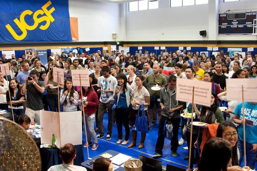A large crowd listens to speakers at the Chancellor's Reception