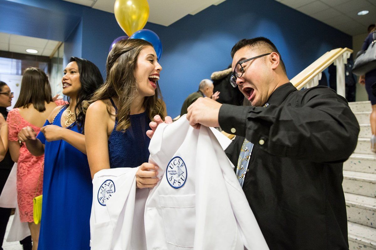 Melika Kasner and Jeffery Wu are sharing a laugh during the department’s white coat ceremony