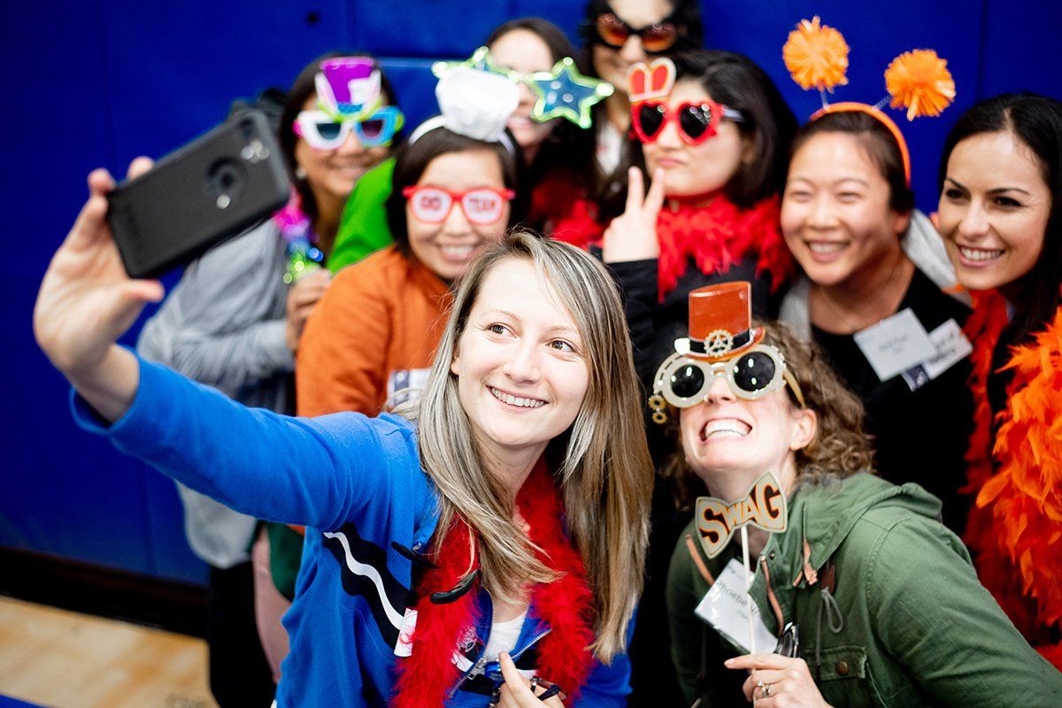 Sheila Lynn Riffe, a first-year nurse practitioner student in the UCSF School of Nursing, takes a selfie with classmates during the chancellor’s annual student reception