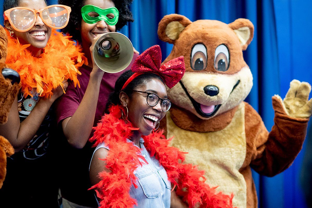 Ivie Tokunboh, a first-year student in the School of Medicine, poses for a photo with friends during a welcome reception at UCSF’s Parnassus campus