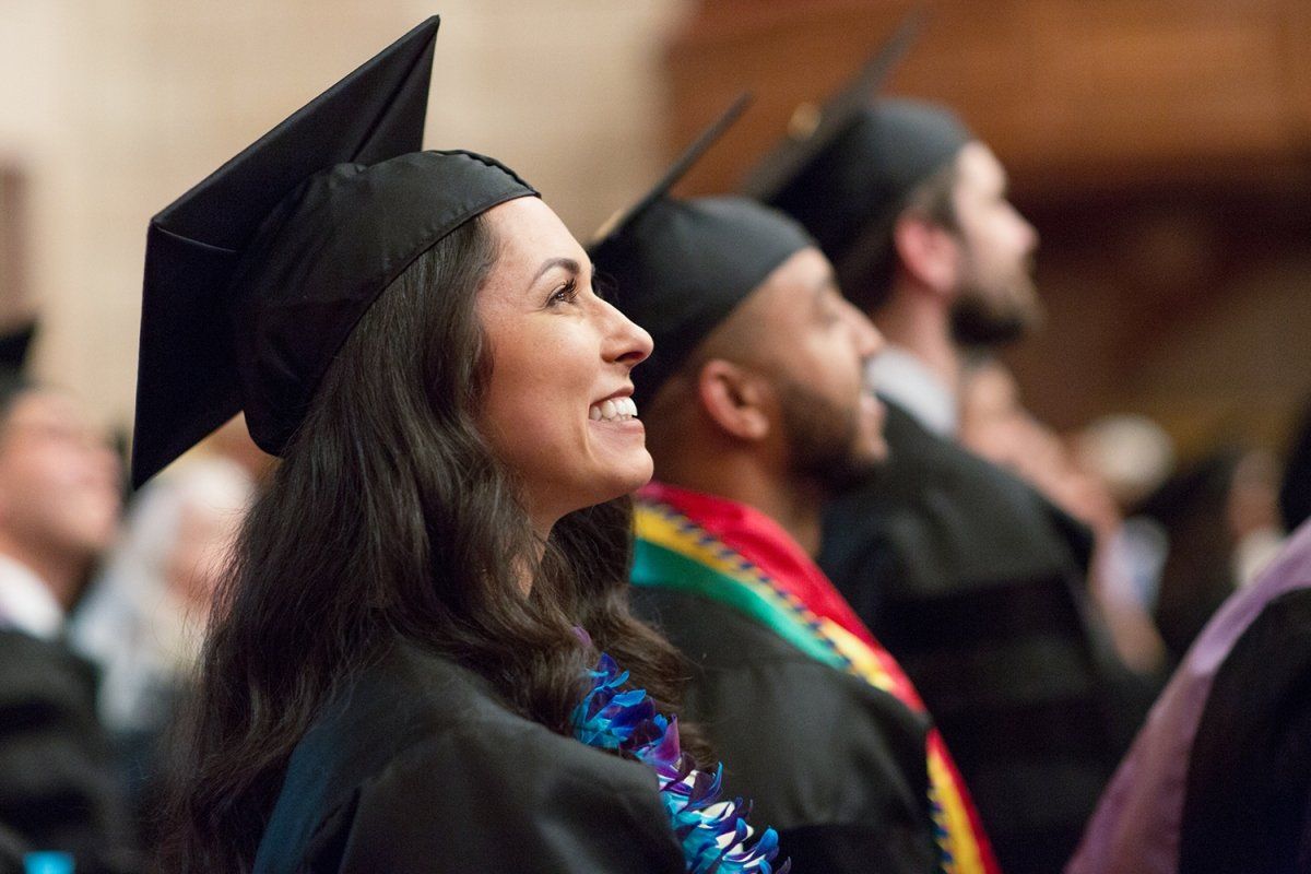 Whitney Bryant looks up at the audience during the School of Dentistry commencement ceremony