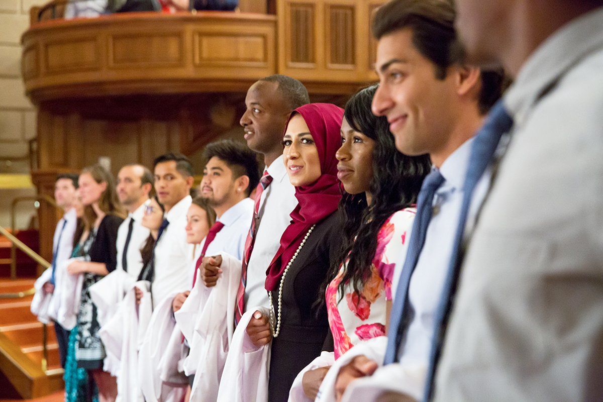 New UCSF School of Medicine students stand during the school’s white coatceremony