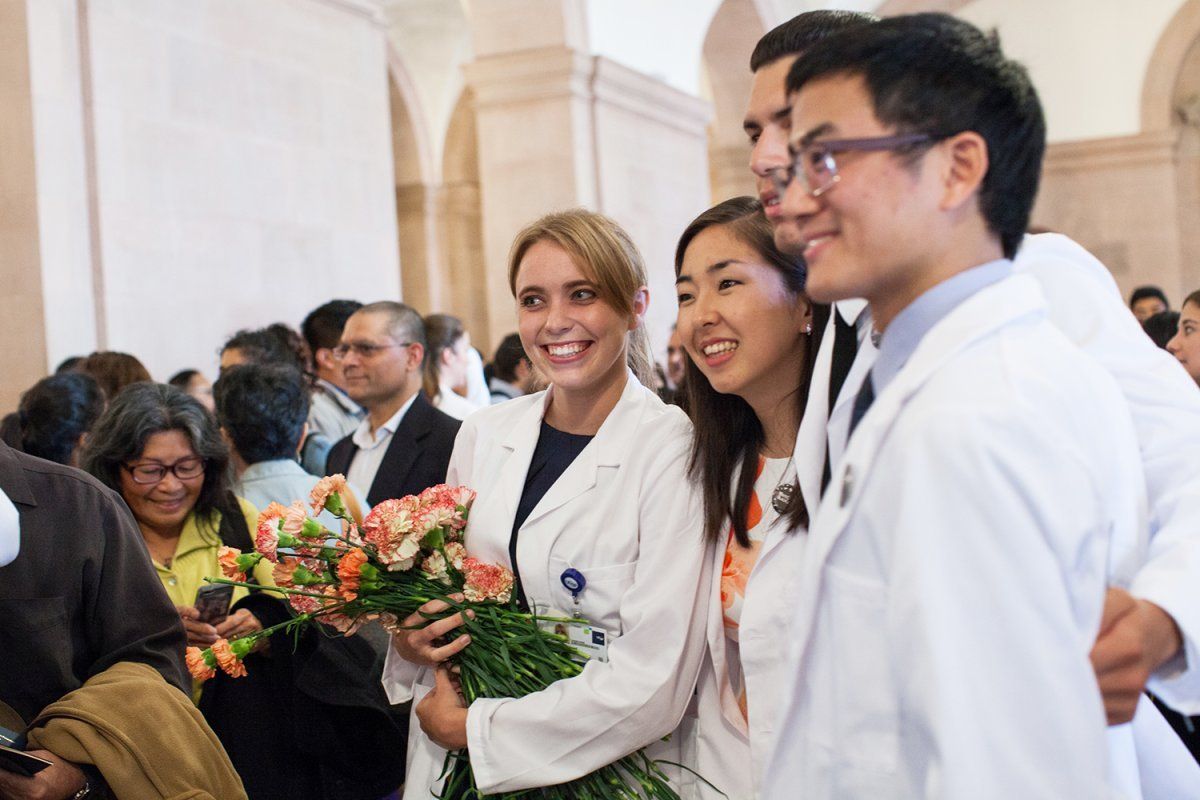 School of Medicine students take photos after their White Coat Ceremony