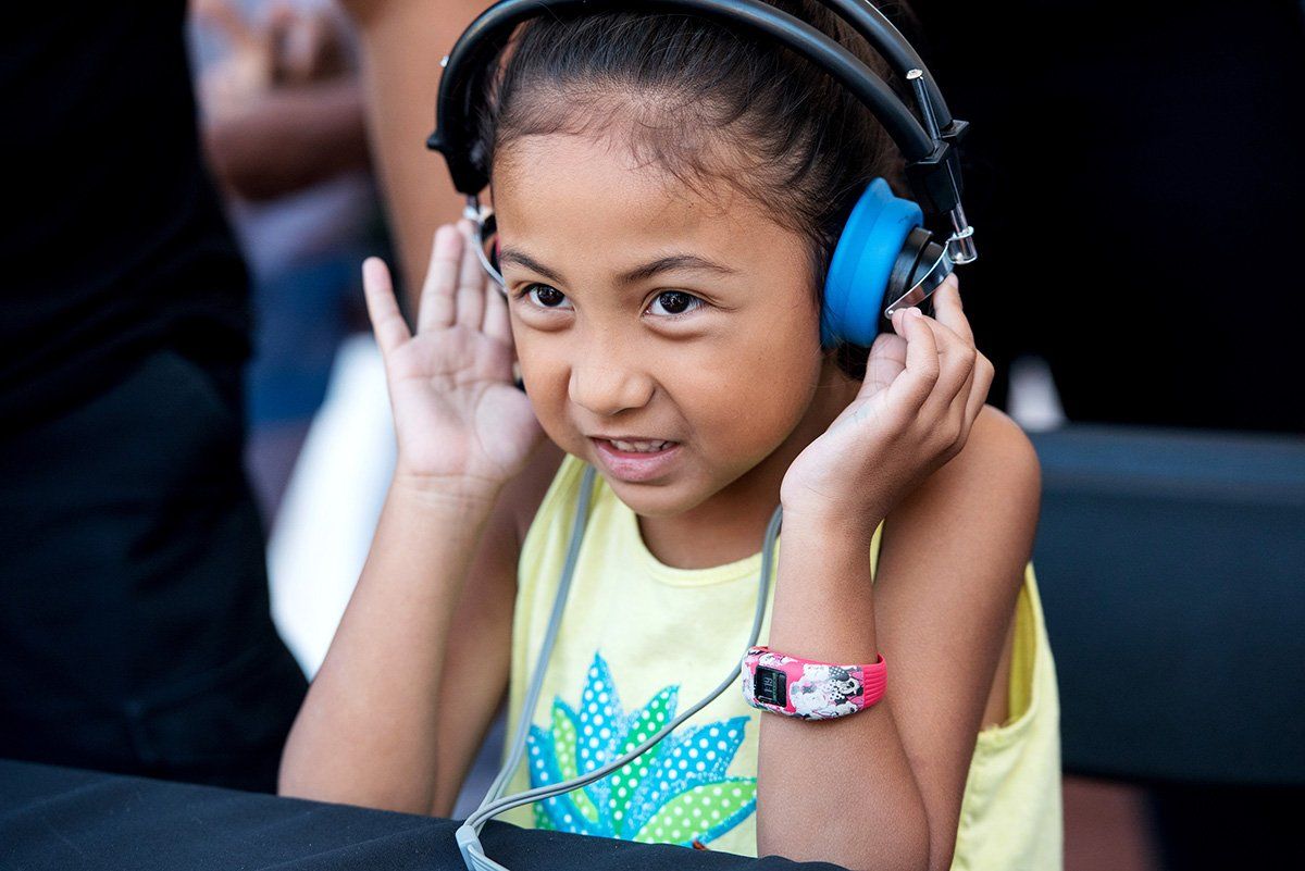 Maya Arcibal, 6, participates in a hearing test at one of UCSF’s tents at the Bay Area Science Festival Discovery Day 2018