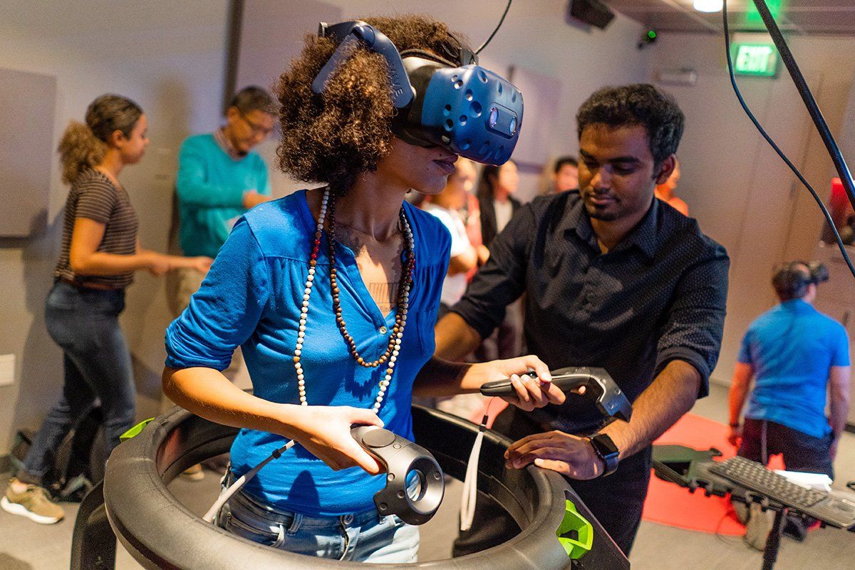 A visitor is trying out virtual reality equipment at the Bay Area Science Festival